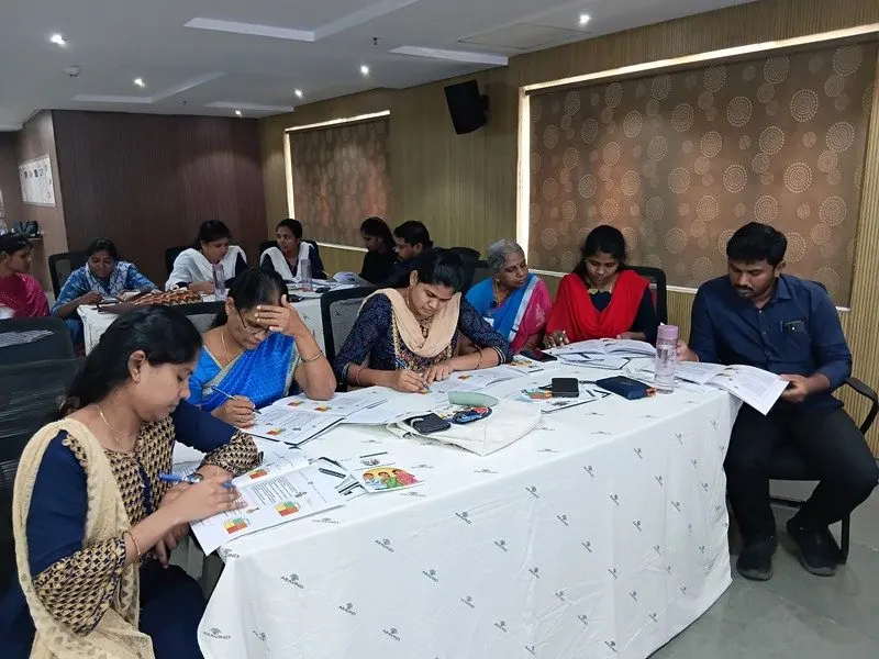 Participants laughing during a group activity