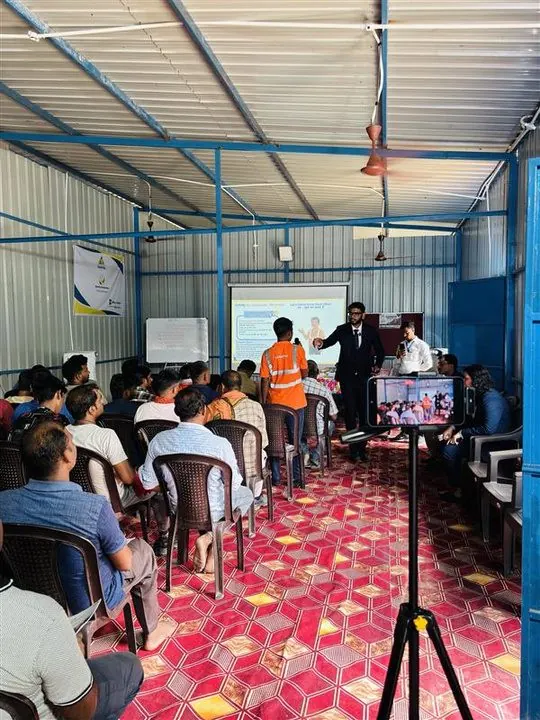 Workers attending a session inside a plant